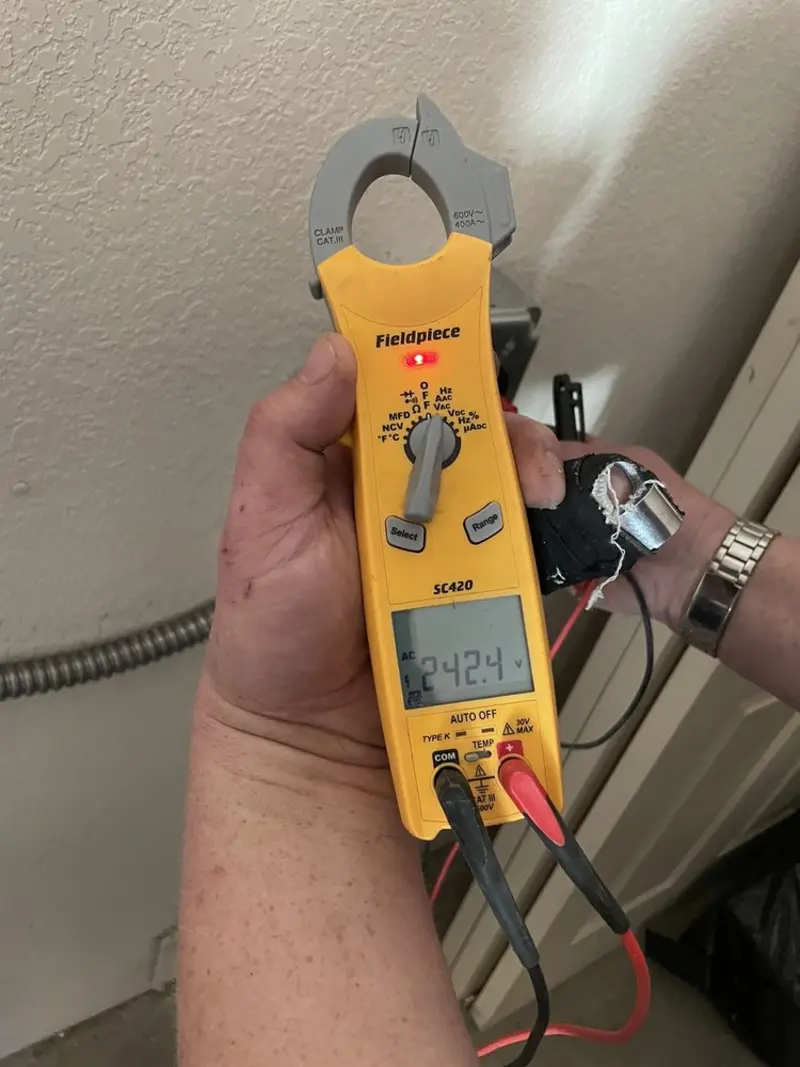 Voltage testing with clamp meter during Generator Installation in Mountain Home